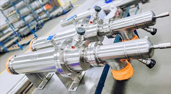 stainless steel sanitary cannabis heat exchangers on a workbench